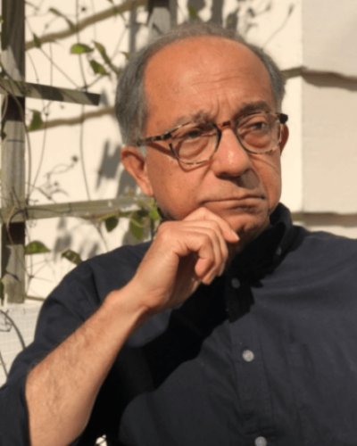 Kaushik Basu thinking and looking off into the distance