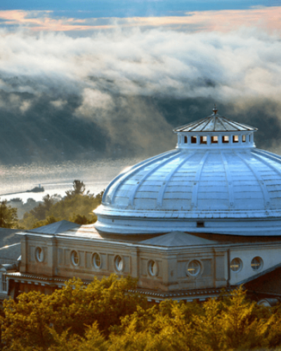 View of the Sibley Hall Dome with Cayuga Lake in the background